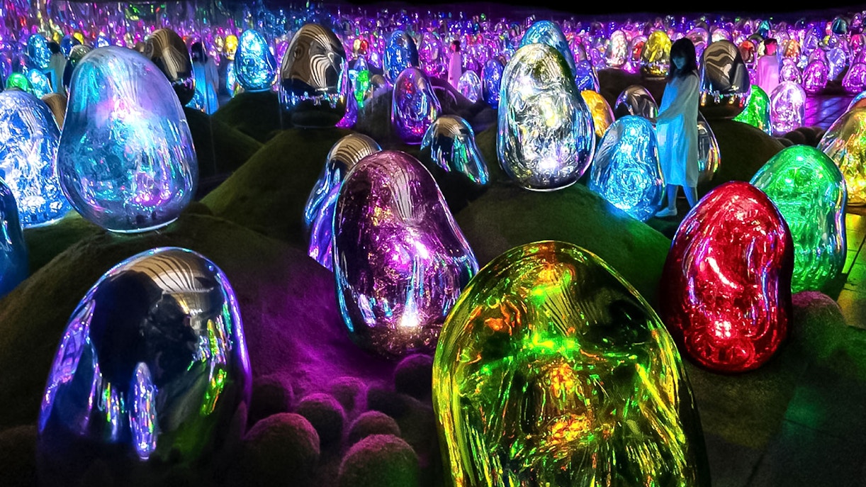 Colorful digital art installations at TeamLab Planets Tokyo with illuminated sculptures.