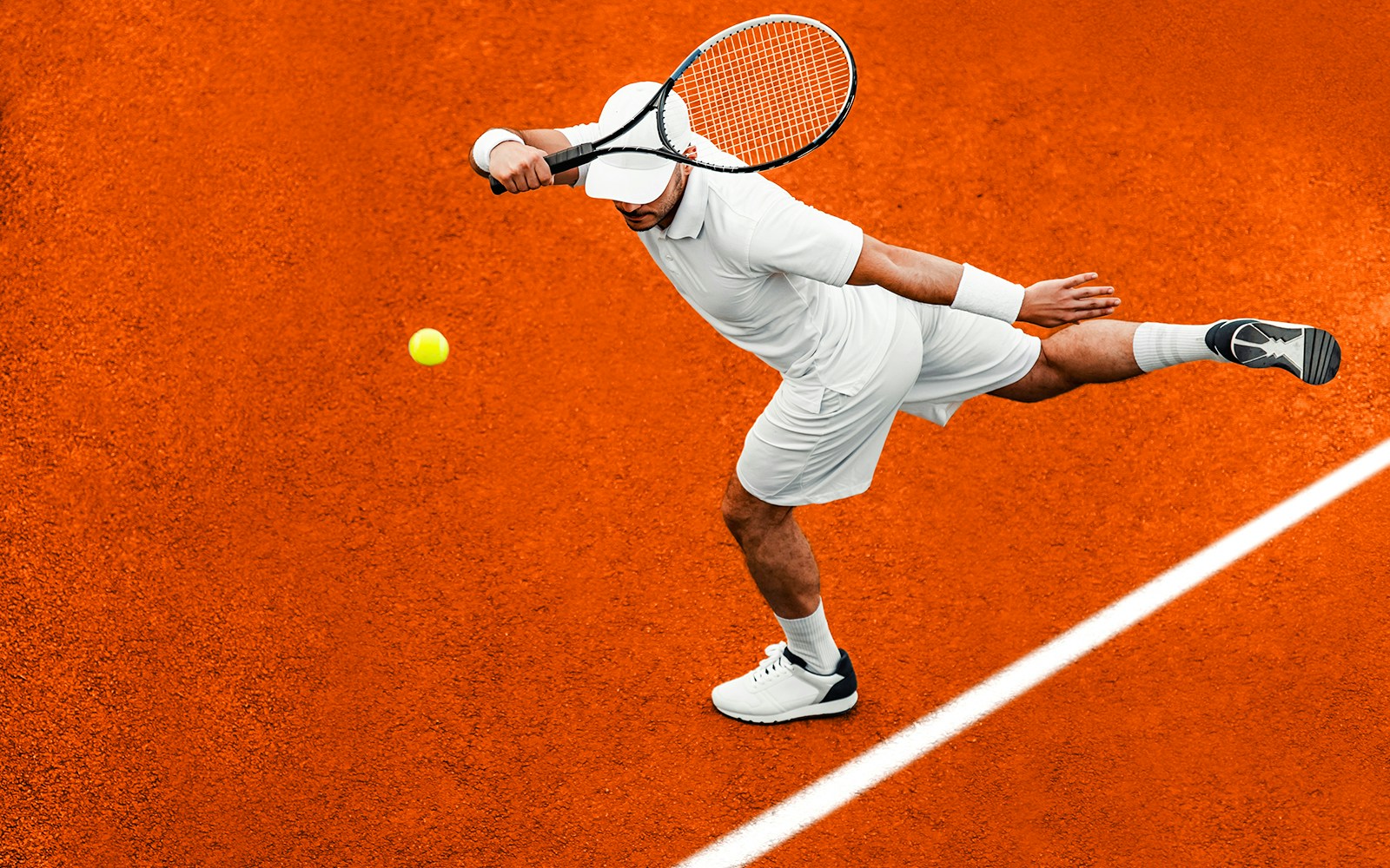 Tennis player serving on clay court at Roland Garros Stadium.