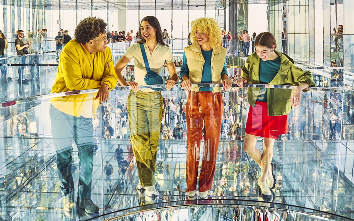 Guests enjoying the mirrored observation deck at Summit One Vanderbilt, New York City.
