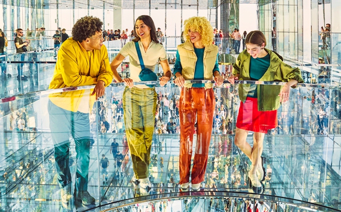 Guests enjoying the mirrored observation deck at Summit One Vanderbilt, New York City.