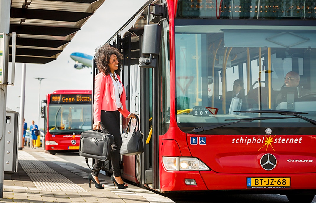woman getting on the bus