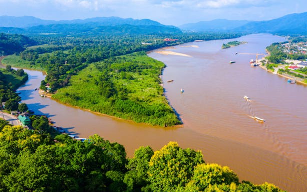 Aerial view of boats on the Mekong River at the Golden Triangle, Chiang Rai, Thailand.