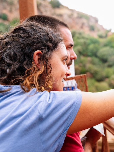 Guide pointing out Ouzoud Falls to tourist, Marrakesh.