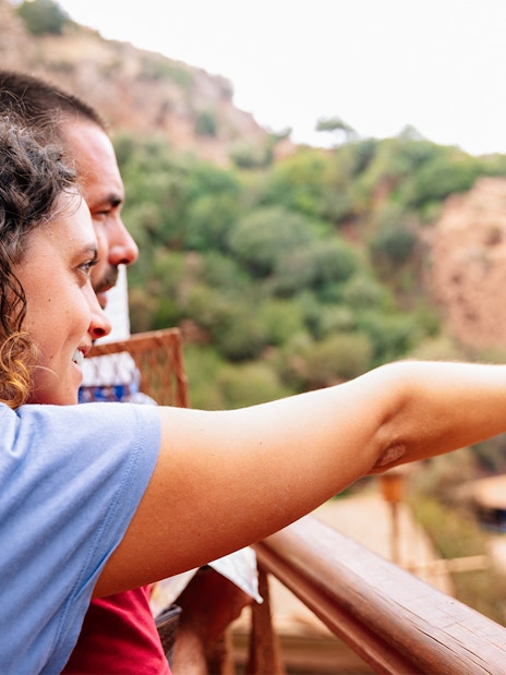 Guide pointing out Ouzoud Falls to tourist, Marrakesh.