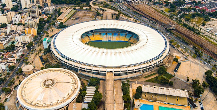 Aerial view of Maracana Stadium in Rio de Janeiro, Brazil, surrounded by cityscape.