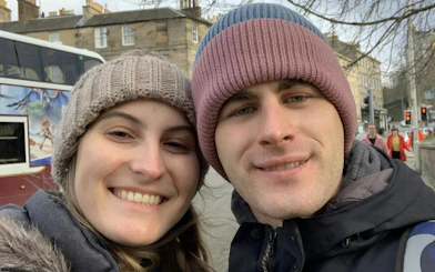 Couple enjoying a self-guided city exploration game in Edinburgh.