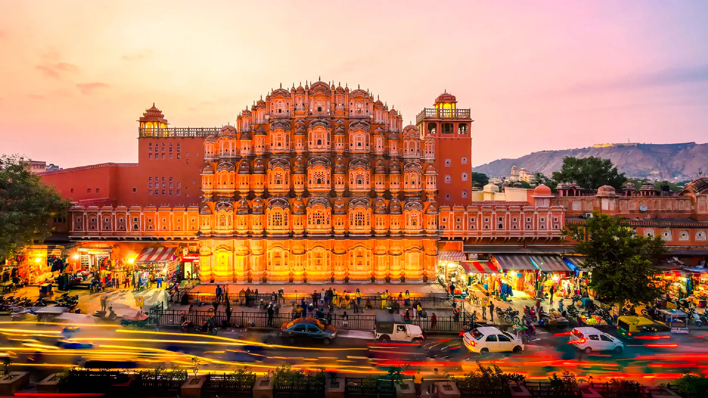 Hawa Mahal facade in Jaipur during sunset, part of a full-day guided tour by car.