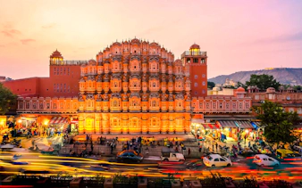 Hawa Mahal facade in Jaipur during sunset, part of a full-day guided tour by car.