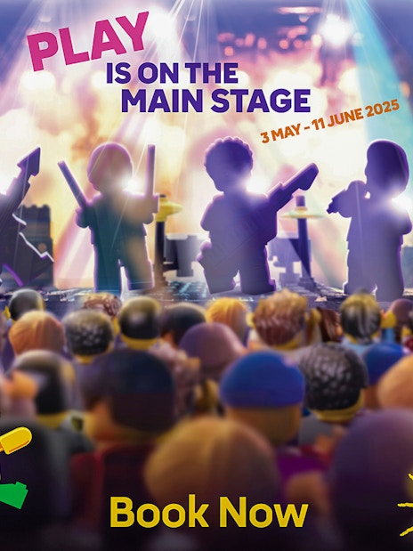 LEGO figures performing on stage at LEGOLAND Windsor Resort festival event.