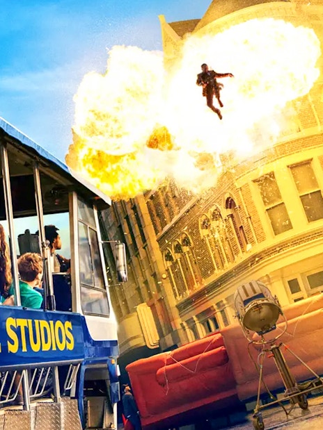 Universal Studios Hollywood tram tour with explosive stunt scene.