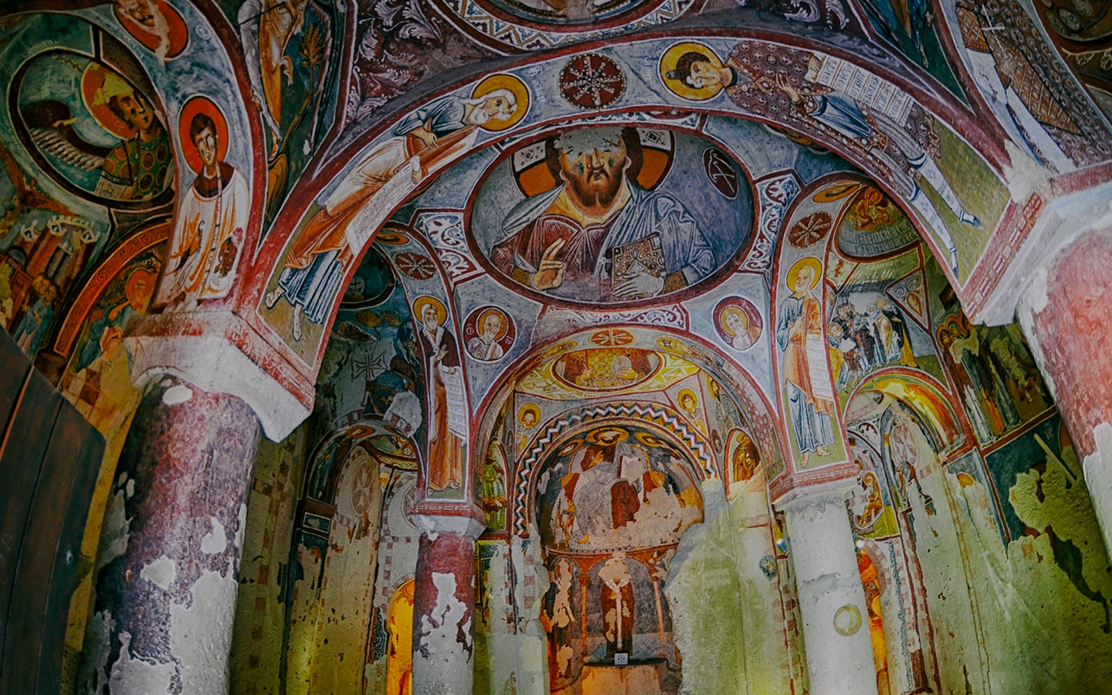 Frescoes on the walls of the Apple Church, Goreme Open Air Museum, depicting religious figures.