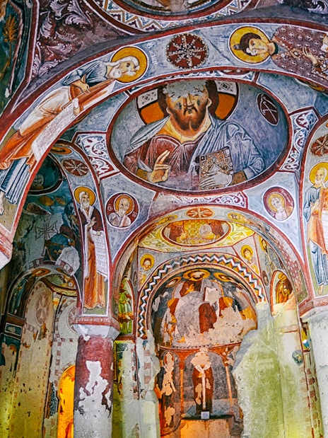 Frescoes on the walls of the Apple Church, Goreme Open Air Museum, depicting religious figures.