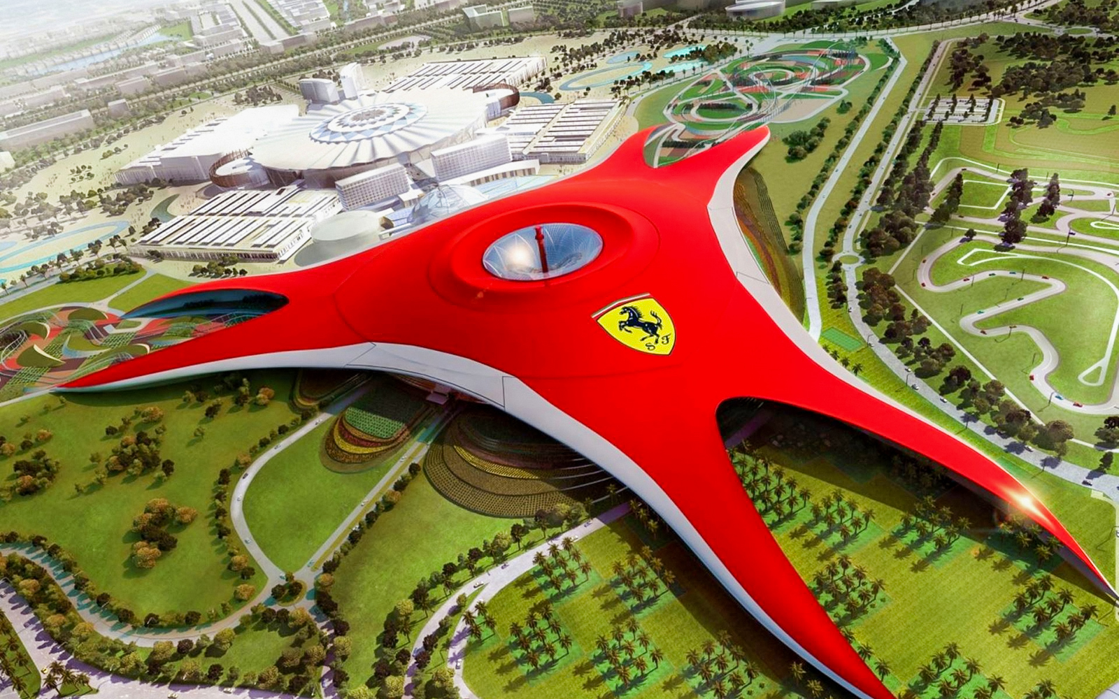 Ferrari World Abu Dhabi aerial view with iconic red roof and surrounding attractions.