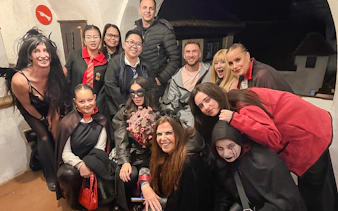 Guests in costumes at Bran Castle Halloween party.