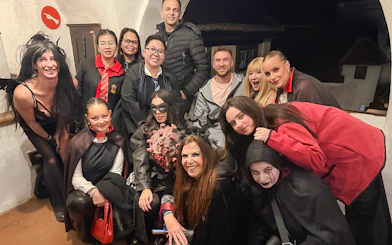 Guests in costumes at Bran Castle Halloween party.
