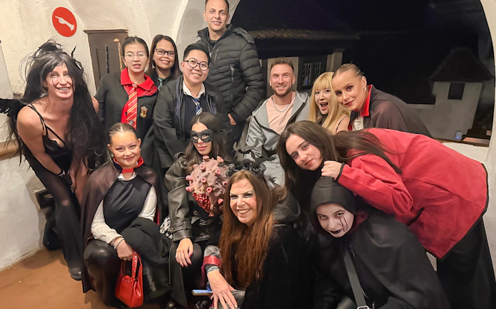 Guests in costumes at Bran Castle Halloween party.