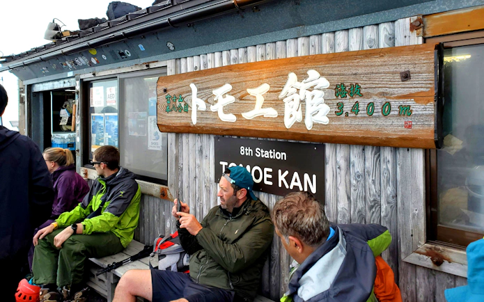 Climbers resting at Tomoe Kan, 8th Station, Mt. Fuji Climbing Tour.