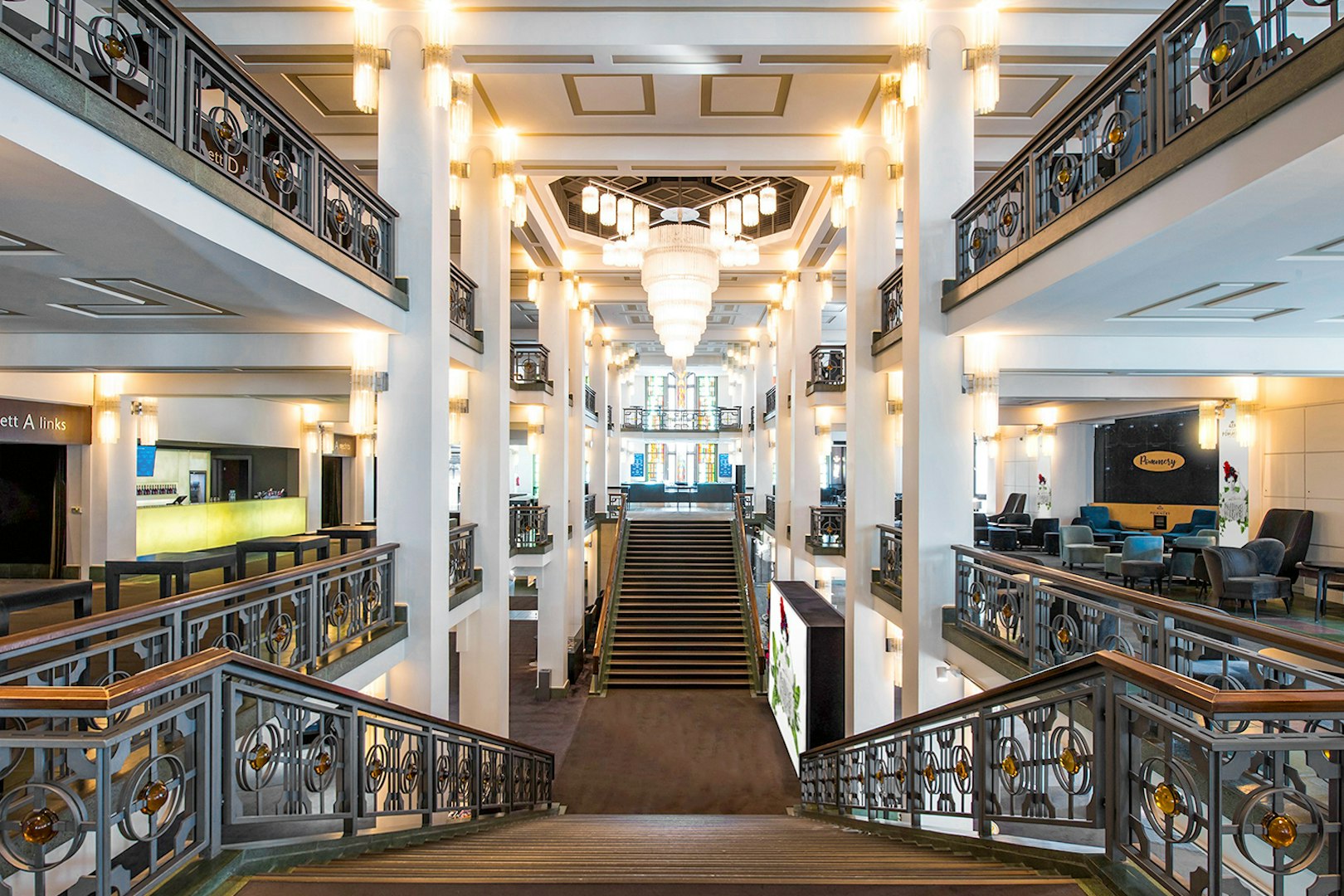 Grand theater lobby with elegant chandeliers and staircase, venue for FALLING | IN LOVE Grand Show.