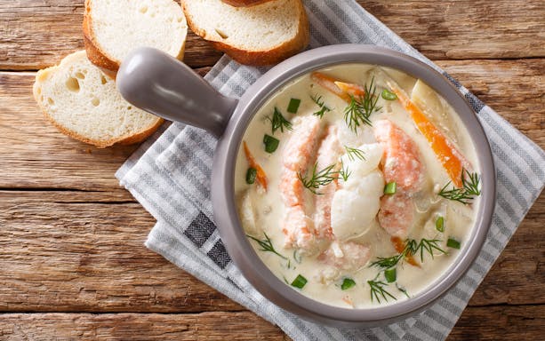 Seafood chowder served with bread on a lunch cruise from Gdansk to Westerplatte.