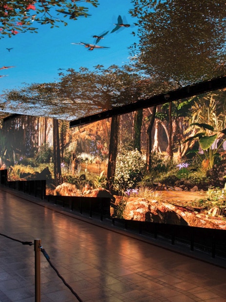 Immersive digital forest display at The Peak Tram Sky Pass, Hong Kong.