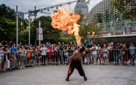 Firebreather performing for a crowd at Singapore F1 event.