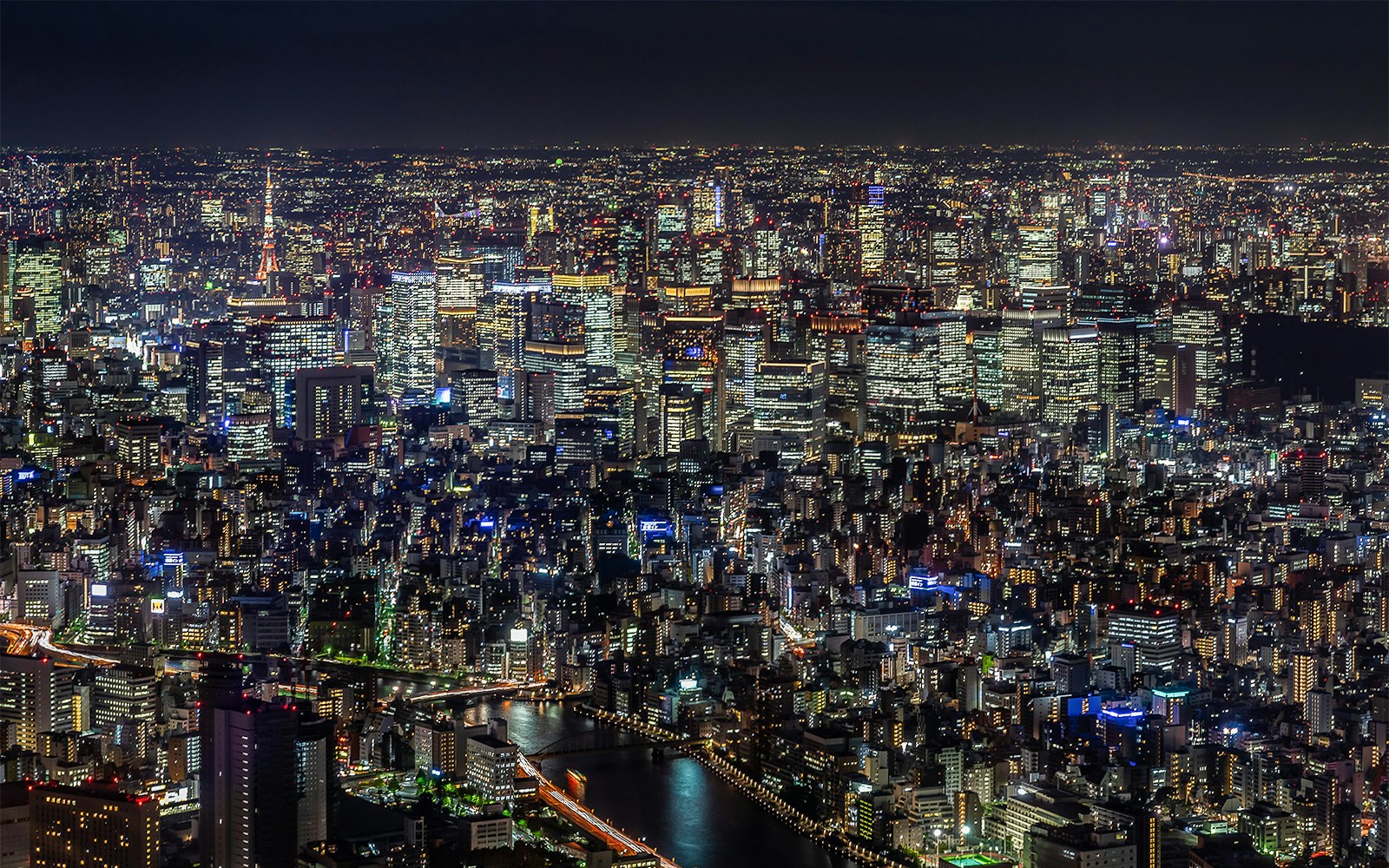 Tokyo skyline illuminated at night from Tokyo Skytree observation deck.