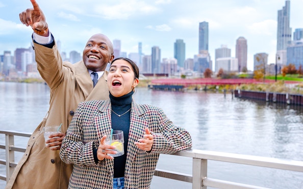 Guests enjoying views on Lake Michigan dinner cruise with Chicago skyline.