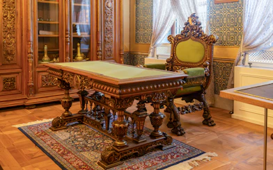 Inside view of ornate wooden furniture in Yıldız Palace, Istanbul, Turkey.