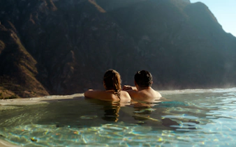 Couple relaxing in Tolantongo hot springs with mountain view, Mexico.