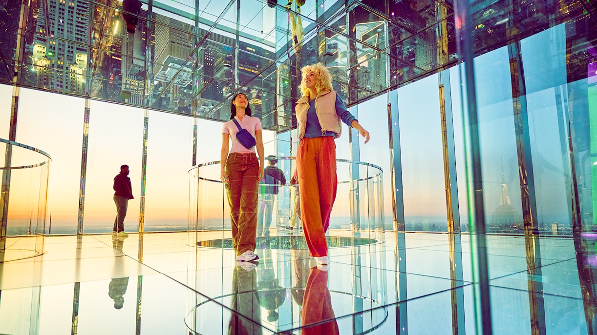 Two women exploring the AIR, a multi sensory experince at Summit One Vanderbilt.