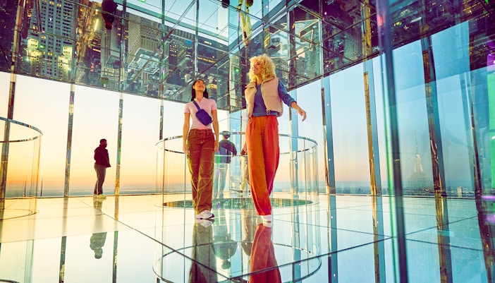Two women exploring the AIR, a multi sensory experince at Summit One Vanderbilt.
