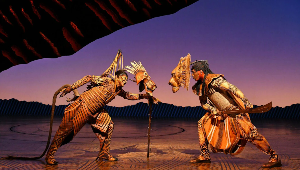 Lion King stage performance with actors in costume, Paris.