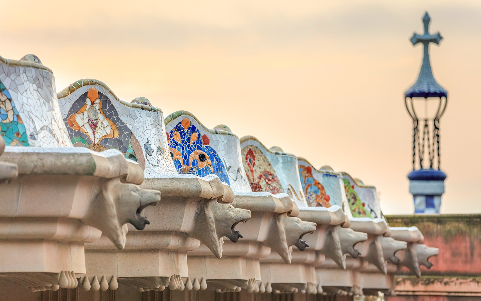Mosaic benches and sculptures at Park Güell, Barcelona, during a guided tour.