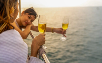 Guests enjoying drinks on a Tiber River cruise in Rome.