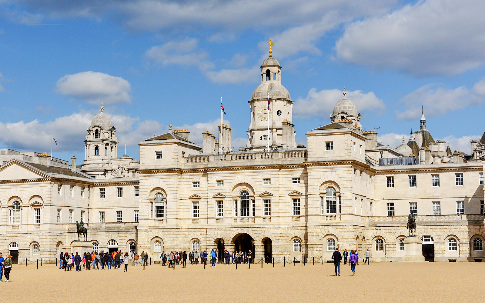 Horse Guards Parade in London with visitors exploring the historic site.