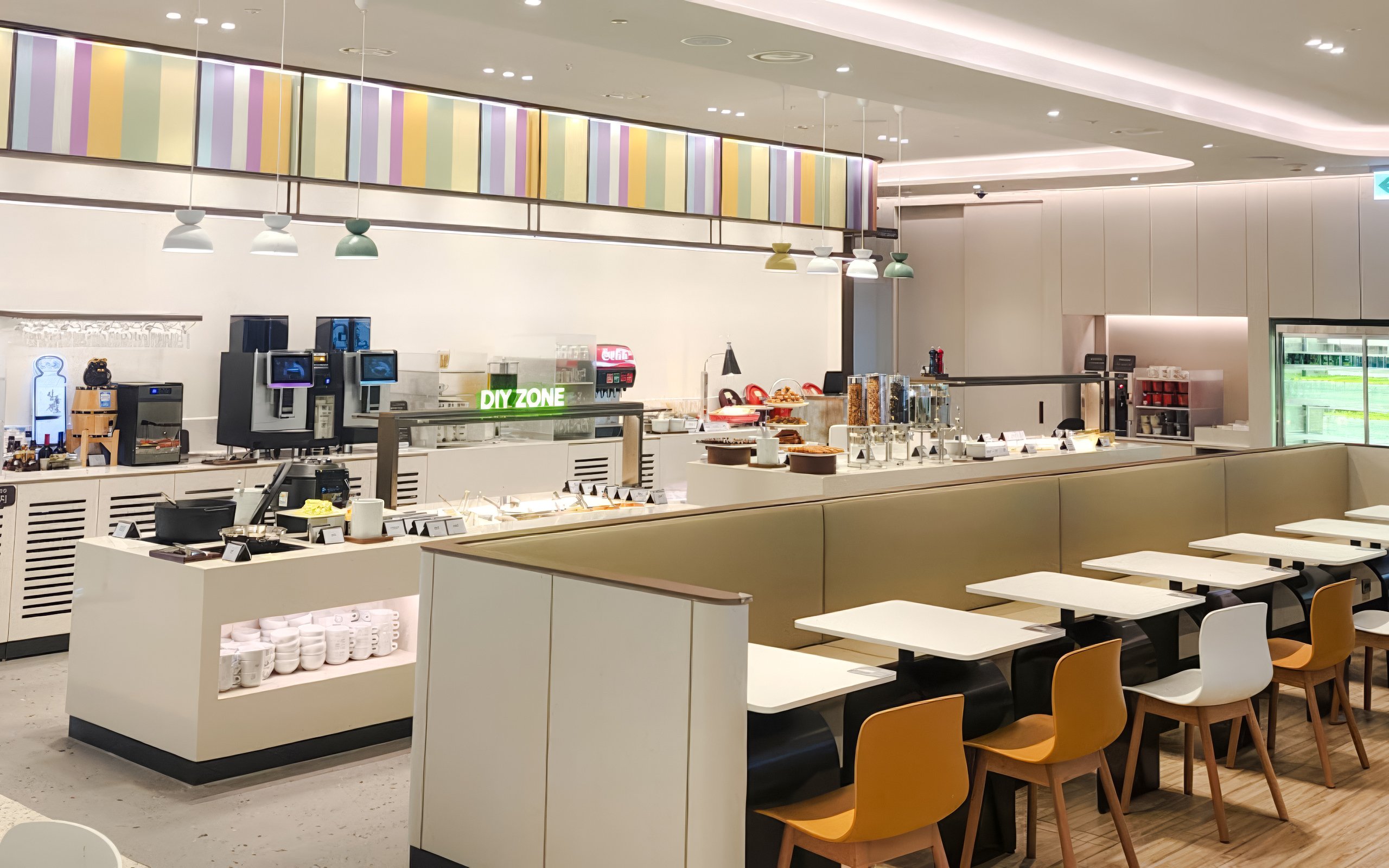 Restaurant seating and self-service area at Sky Hub Lounge, Seoul Incheon Airport East Concourse.