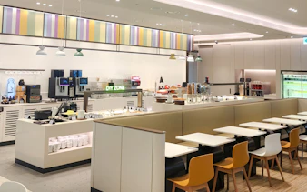 Restaurant seating and self-service area at Sky Hub Lounge, Seoul Incheon Airport East Concourse.
