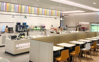 Restaurant seating and self-service area at Sky Hub Lounge, Seoul Incheon Airport East Concourse.
