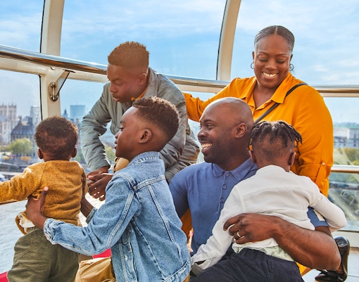 Family enjoying view of Big Ben from London Eye capsule.