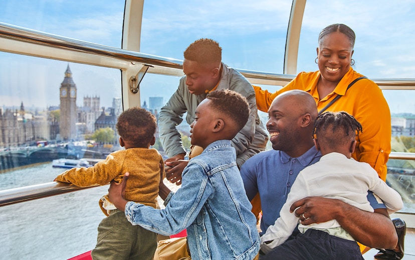 Family enjoying view of Big Ben from London Eye capsule.