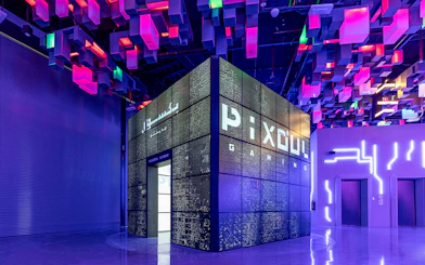Pixoul Gaming area at Al Qana, Abu Dhabi with vibrant ceiling lights.