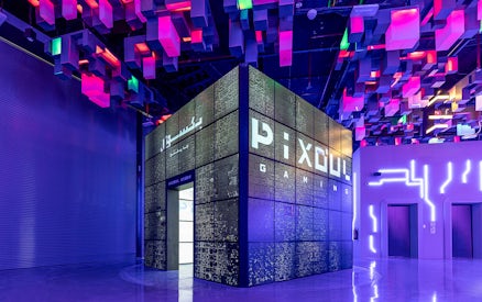 Pixoul Gaming area at Al Qana, Abu Dhabi with vibrant ceiling lights.