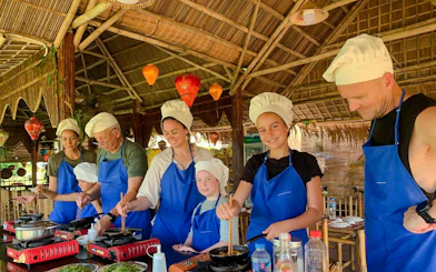 Group cooking class in Hoi An, part of the 3 Heritage Craft Villages Bicycle Tour.