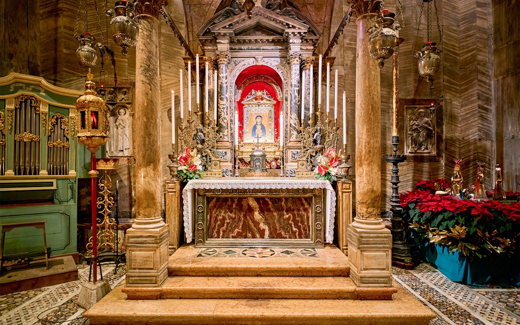 St. Mark's Basilica altar with ornate decorations and religious iconography in Venice, Italy.