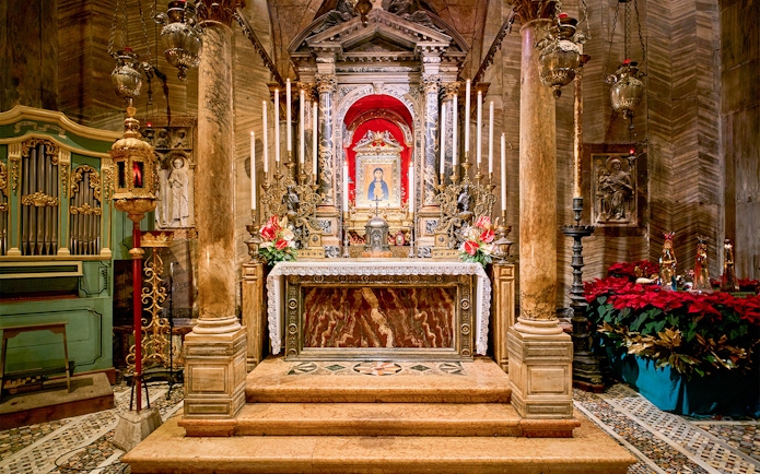 St. Mark's Basilica altar with ornate decorations and religious iconography in Venice, Italy.