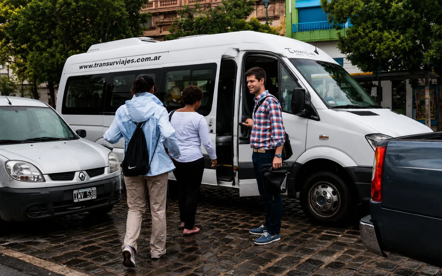 Tourists boarding a van for the Buenos Aires City Highlights Tour.