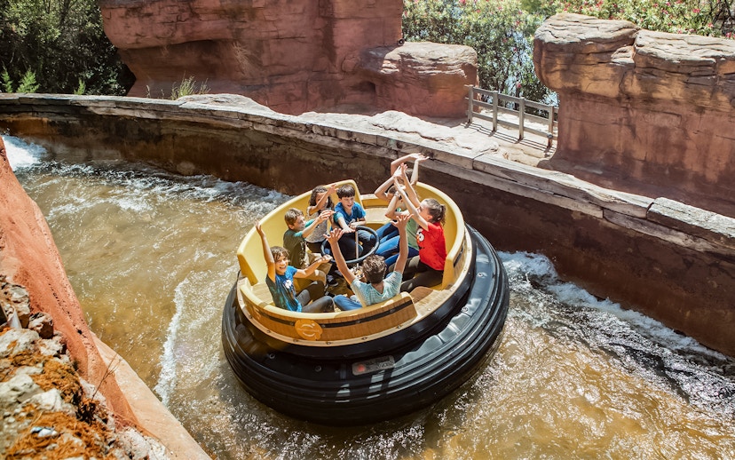Raft ride with people enjoying water rapids at PortAventura.