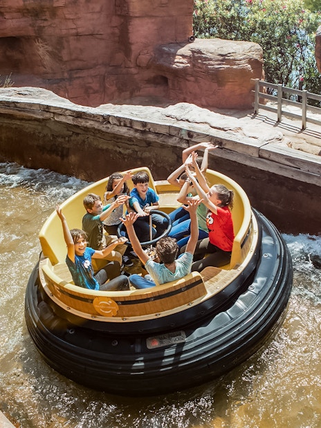 Raft ride with people enjoying water rapids at PortAventura.
