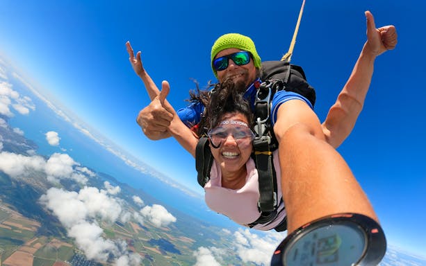 Tandem skydive over Cairns with ocean and landscape views.