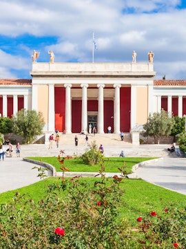 National Archaeological Museum entrance with columns and visitors in Athens, Greece.